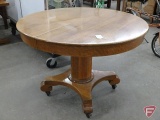 Wood 45in round pedestal table, on wheels