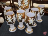White glass with gold colored trim 16inH pitcher and 6 glass set
