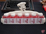 Plastic chef shelf with condiment containers and glass jar salt/pepper shaker in plastic holder