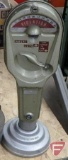 Vintage oil heater and coin operated parking meter 19inH. 2 pieces