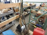 Yard and garden tools, scoop shovels, rakes, hoe, picks. All tools standing in corner of cart.