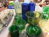 Colored glass dishes: green cups, green dishes, yellow vases, yellow serving tray,