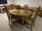Colonial table by Drexel, 2 leaves, 4 chairs cane-like with upholstered seats