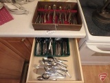 Silverware in box and in drawer, not all matching