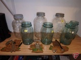 Assortment of coffee pots, jars, wall plaques (middle shelf)
