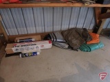 (4) tarps and plastic sheeting. All items on floor under bench