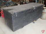 Painted wood box on wheels, hinged top, box is 25inHx64inWx24inD