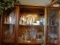 Contents of top 2 shelves: crystal, clear glass, ceramic chickens, angels, children's dishes