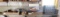 Contents of shelf: detail brush sets, tape measure, spark plugs, magnesium fire starters,