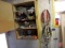 Contents of cupboards and 2 hooks: welding rods, measuring sticks, pressure gauge, head lamp,