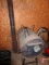 Barrel wood burning stove on stand with smoke pipe, 23