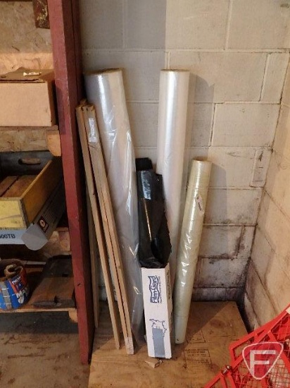 Rolls of plastic and 1x4"x47" wood