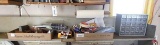 Contents of shelf: detail brush sets, tape measure, spark plugs, magnesium fire starters,