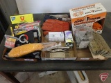 Locking pliers, measuring sticks, light bulbs, flash light, 100' measuring tape, rodent poison,
