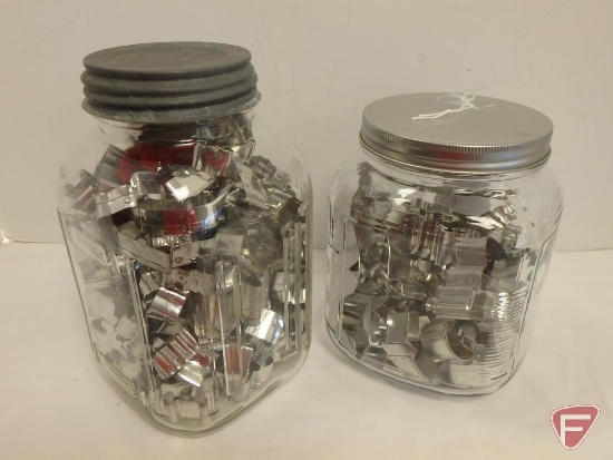 (2) Glass canisters with metal miniature cookie cutters. Both