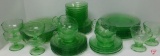 Green depression glass items, saucers, bowls, plates, cream/sugar, cups, dessert cups.