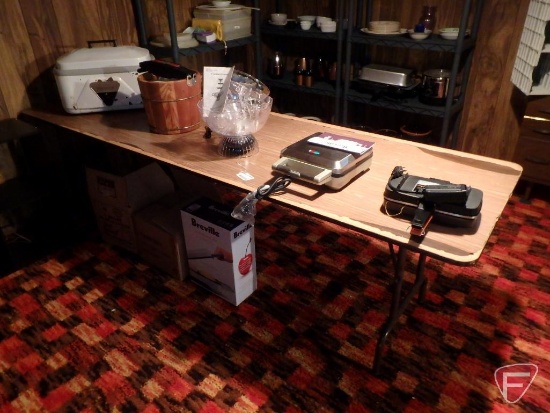 Folding table and contents: New drink/water fountain, Breville pie cooker, ice cream maker,