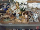 Snow globes, artificial orchid, Jerusalem ashtray, votive holders, and figurines