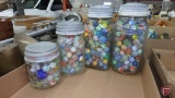 Collection of marbles in (4) jars. Some pitting.