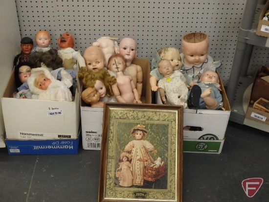 Assortment of dolls and doll parts, some vintage, porcelain and plastic, and framed doll print.