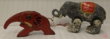 Vintage cast iron elephant nutcracker and vintage wood elephant pull along toy with moving legs.