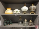 (5) vintage oil lamp bases and (3) globes and shades and (3) Coleman Avon decanters 6inH.