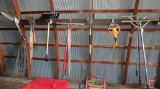 Garden hose, spray nozzle, (2) aluminum scoop shovels, rock rakes, (2) 5 tine pitch forks,