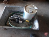 Grout mixing tub, FloTec 1/2hp water pump, and partial can wetlook stabilizing sealer