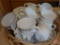 Corelle by Corning/Pyrex cups and saucers. Contents of basket.