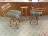 (2) upholstered seat swivel stool, seat is 25inH, and (3) wood stools 29inH. 5 pieces