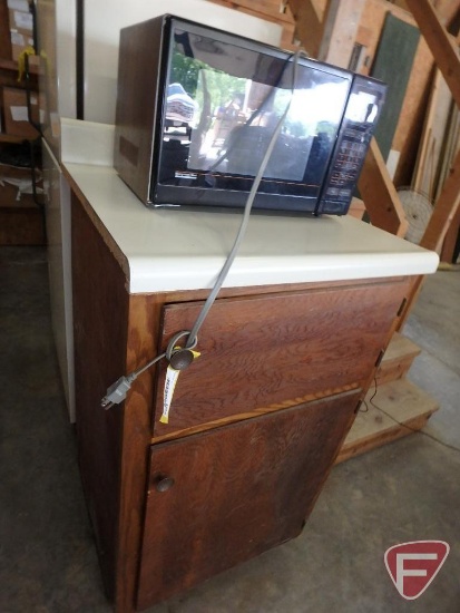 Montgomery Ward microwave and cabinet (44"X25"25")