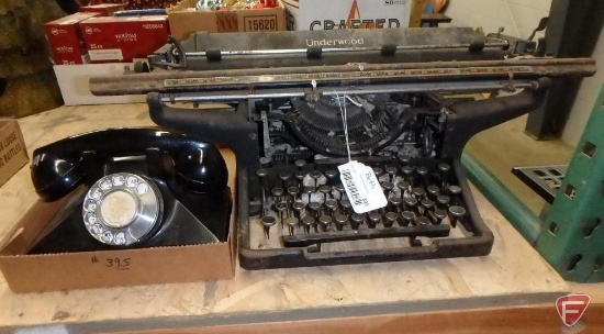 Vintage Underwood typewriter and table-top rotary phone. 2 pieces