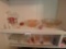 Pink depression glass and other glass dishes: pitcher, measuring cup, dishes, cake platters