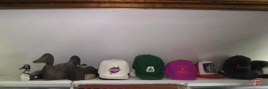 (2) wood duck decoys, porcelain loon, advertising baseball-style caps, and Glenover felt hat