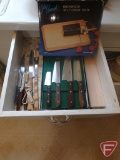 Knives, butcher block, and beechwood cheese slicer. Contents of drawer