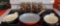 Prizer Ware cast iron fry pan, (2) cast iron casserole dishes, and set of 8 glasses in holder