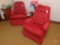 (2) red upholstered swivel rocker chairs. Both