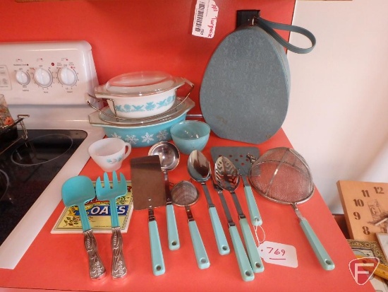 Pyrex casseroles, melmac dishes, Sunbeam hair dryer, kitchen utensils. All in aqua color.