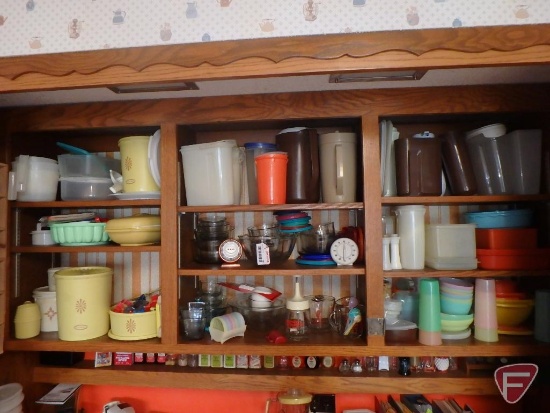 Tupperware, cookie cutters, glass bowls, timers, measuring spoons. Contents of 9 shelves