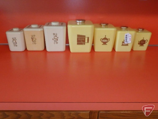 Plastic canister sets. 7 pieces on counter