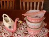 Pink/white Pyrex dishes, Nouvelle Pottery watering swan, glass cookie jar, melmac saucers, cups,