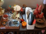 Windchimes, bird clock, chickens, planters, and table lamp, 16inHx60inWx21inD coffee table