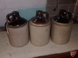 (3) crock jugs, one with ding