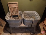 Metal tubs on stand with rug beater and washboard