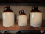 (3) crock jugs, with some dings. 3 pieces