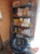 Shelf and contents: air filters, oil filters, spark plugs, (2) Ford Bronco spare tire covers,