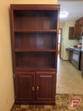(2) matching bookshelves, one with 2 doors at base