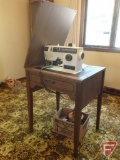 Singer 4623 sewing machine in cabinet with thread holder, buttons, pins