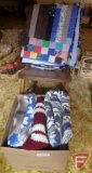 Rocking chair with blankets, quilt, and afgan