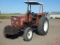 Hesston 80-66 wide front utility tractor, 2930 hours, rock box, canopy